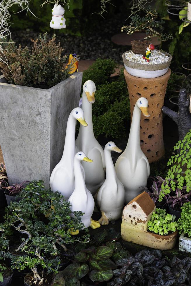 Ceramic geese in a garden photo