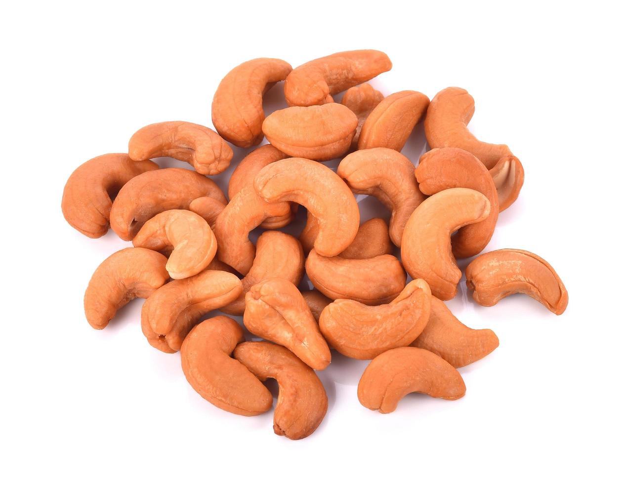 Roasted salted cashews isolated on a white background photo