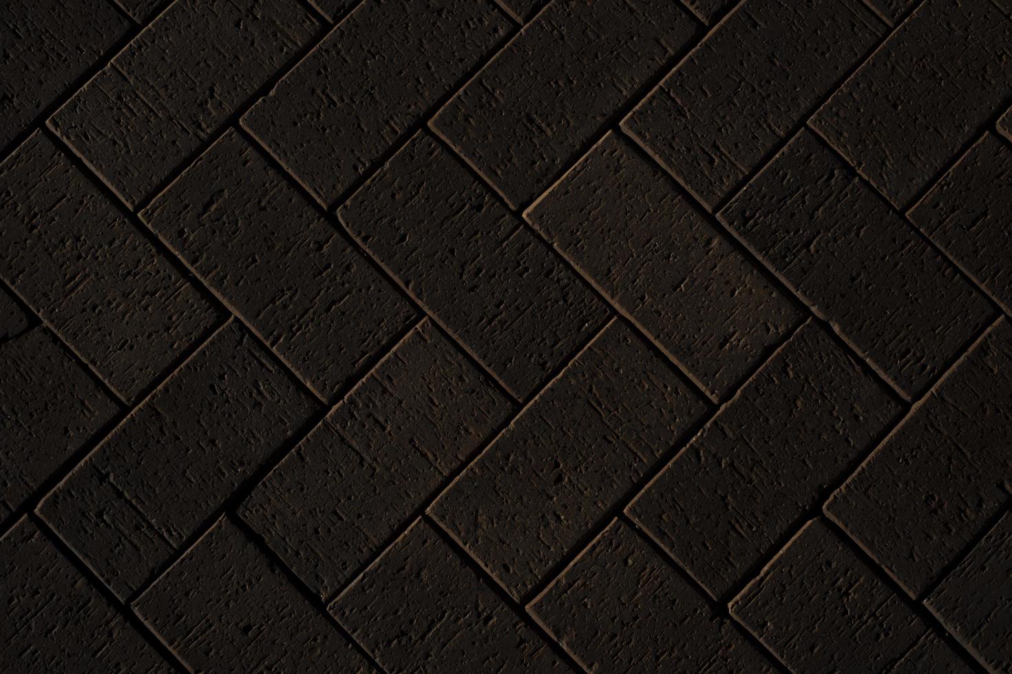 Black brick wall background, brick room, interior texture, wall background photo