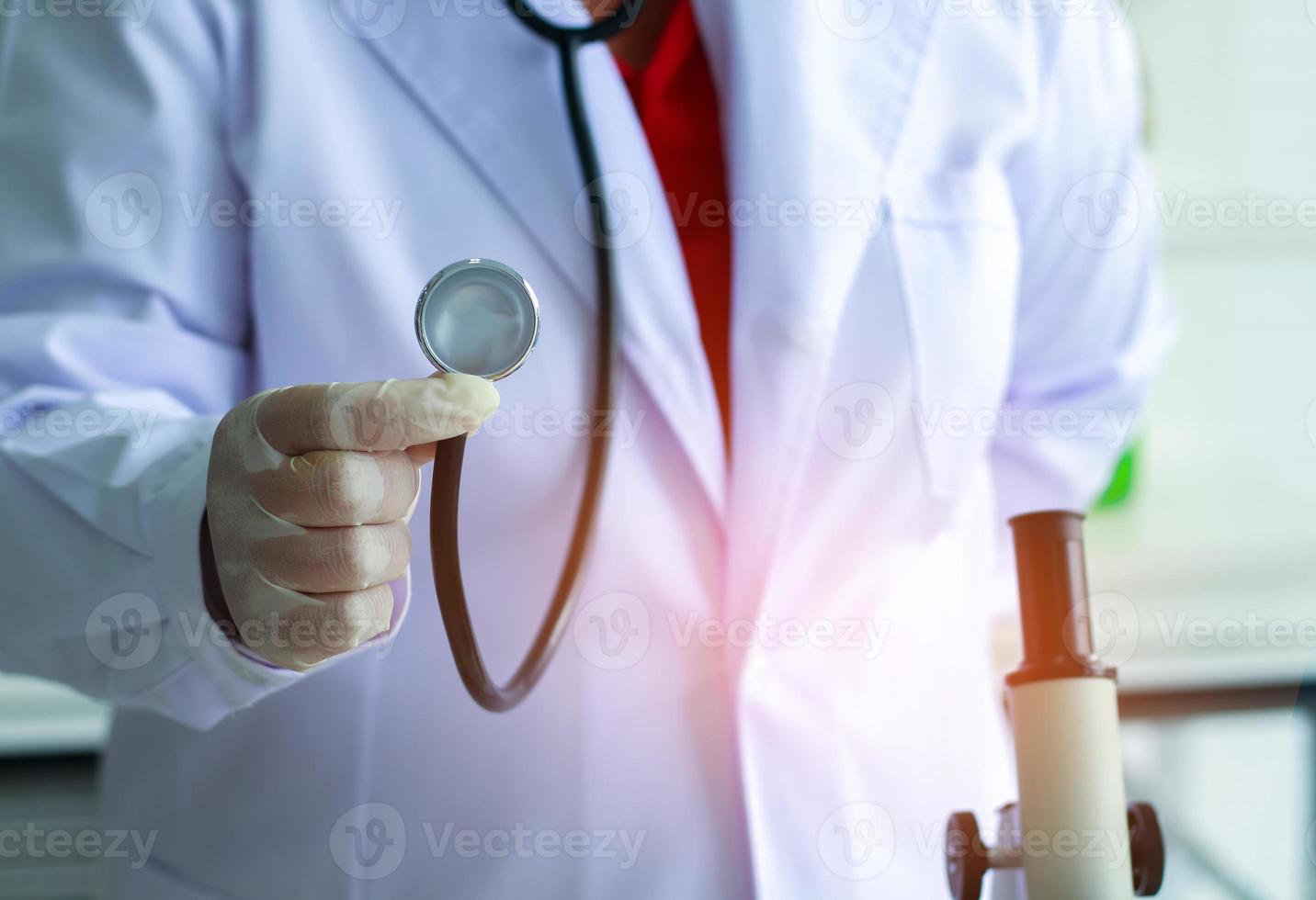 Close-up hand of a doctor with a stethoscope photo