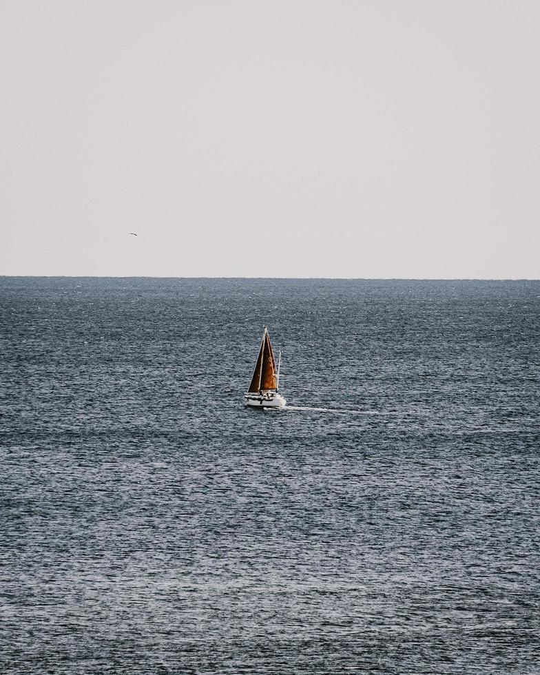 Sailboat on sea during daytime photo