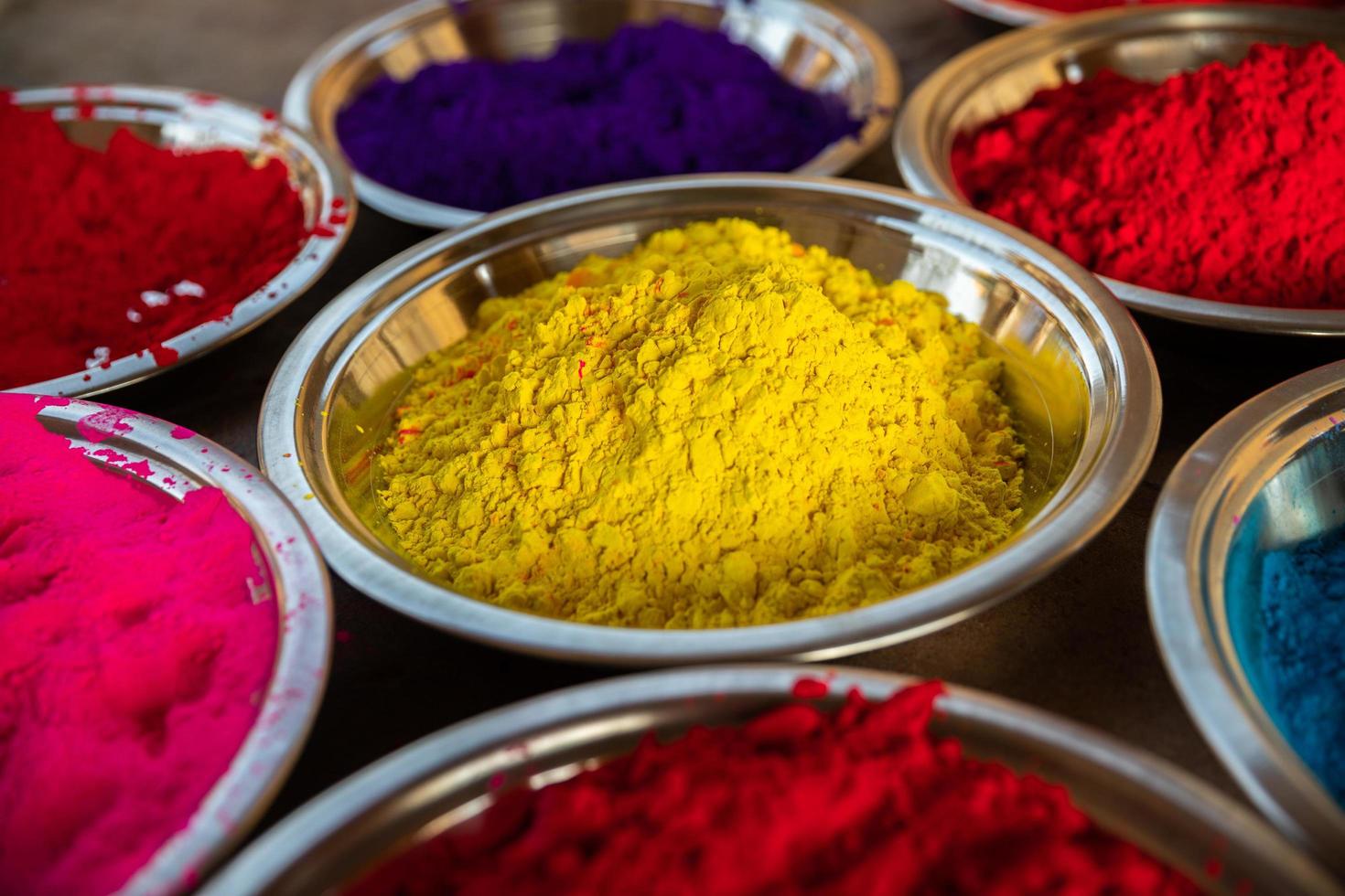 Silver bowls with colorful powders photo