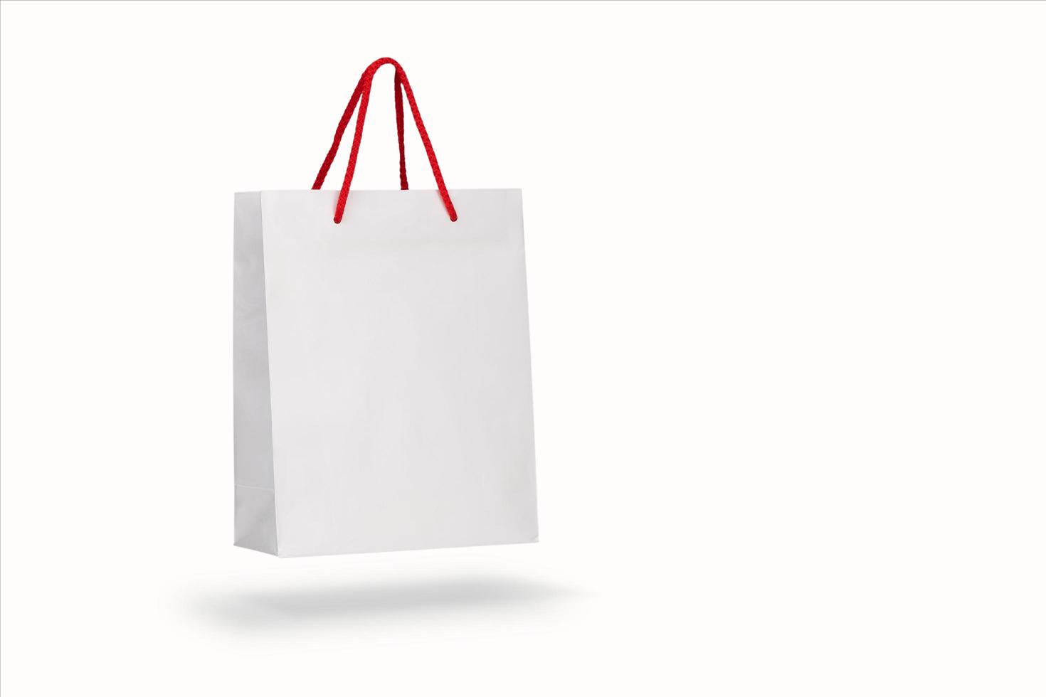 Mockup of a recycled craft paper bag isolated on a white background photo