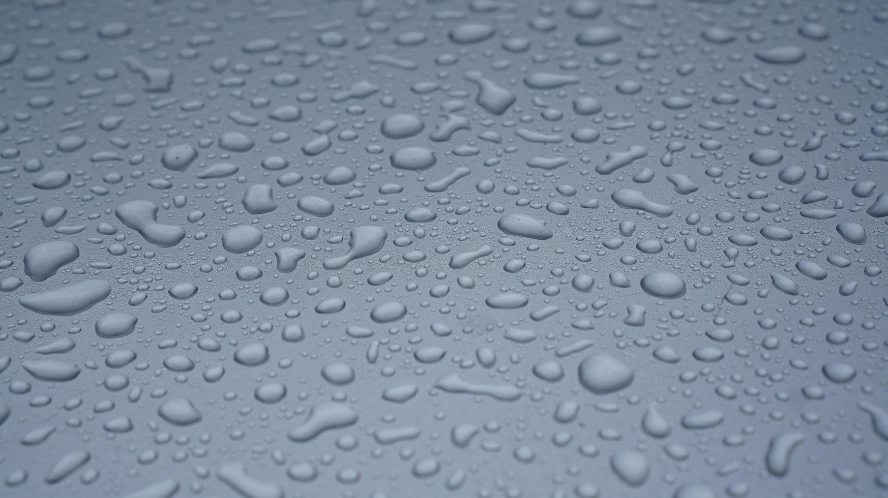 Waterdrop on a surface of a gray window isolated photo