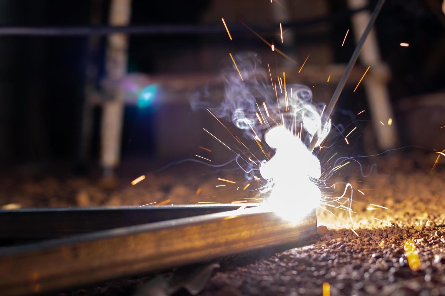 Technician welding on spark light photo