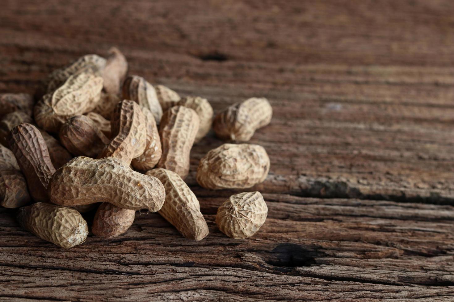 Peanuts on a wooden background photo