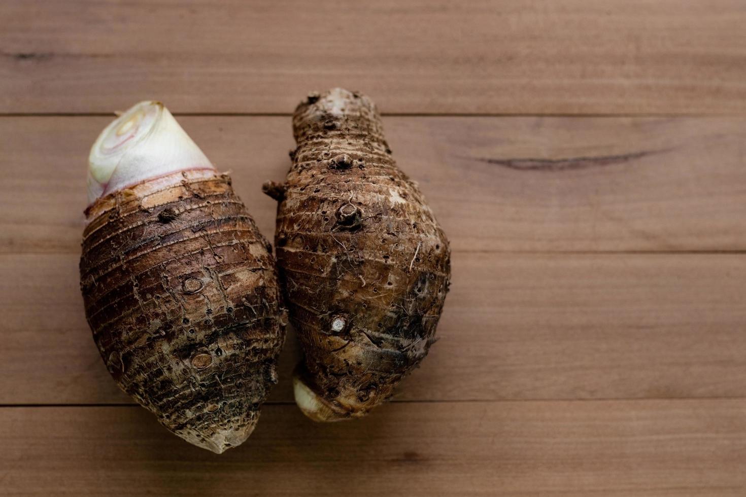 Taro on wood table background photo