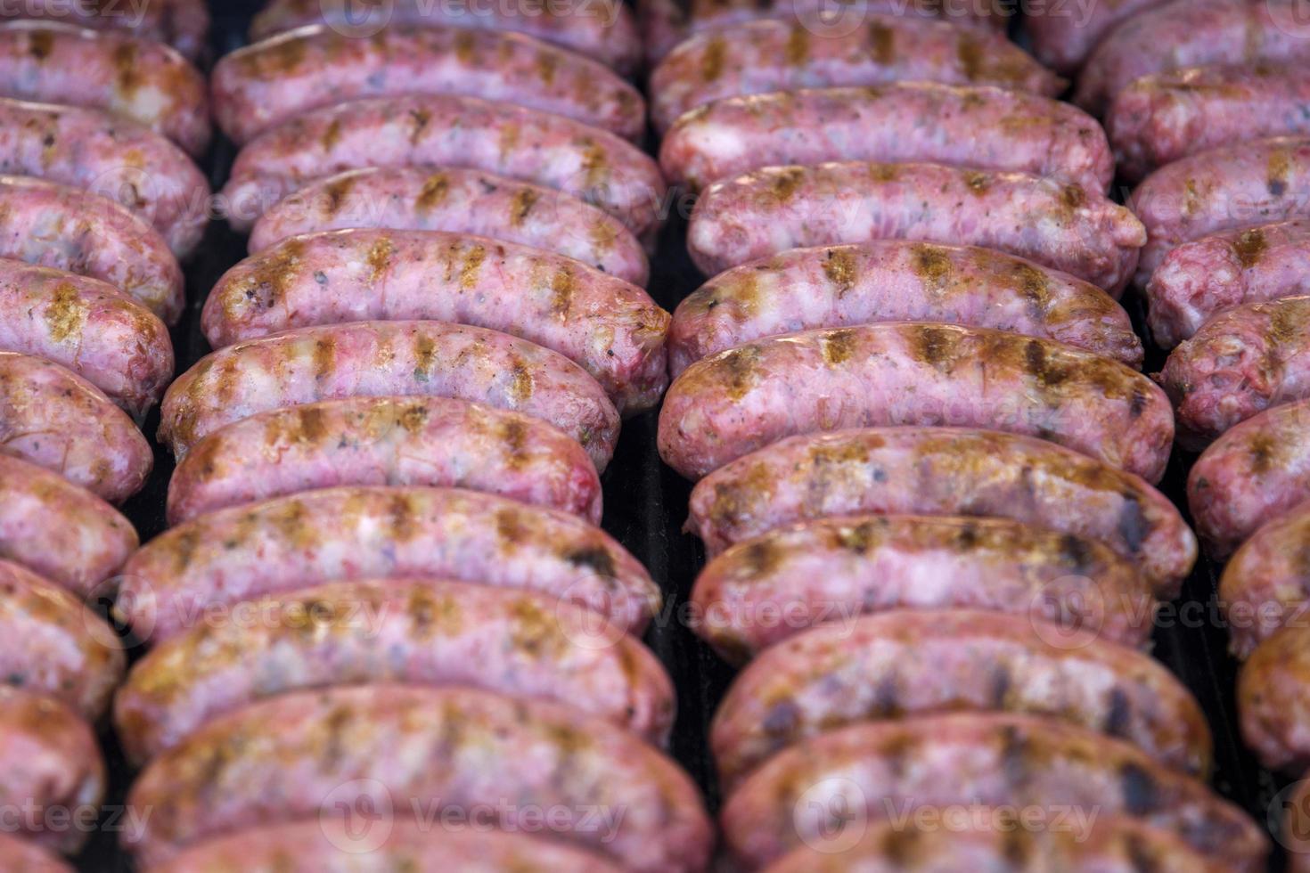 Grilling sausages on the barbecue photo