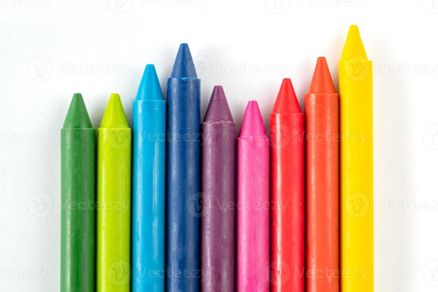 Crayons and pastels isolated on white background photo