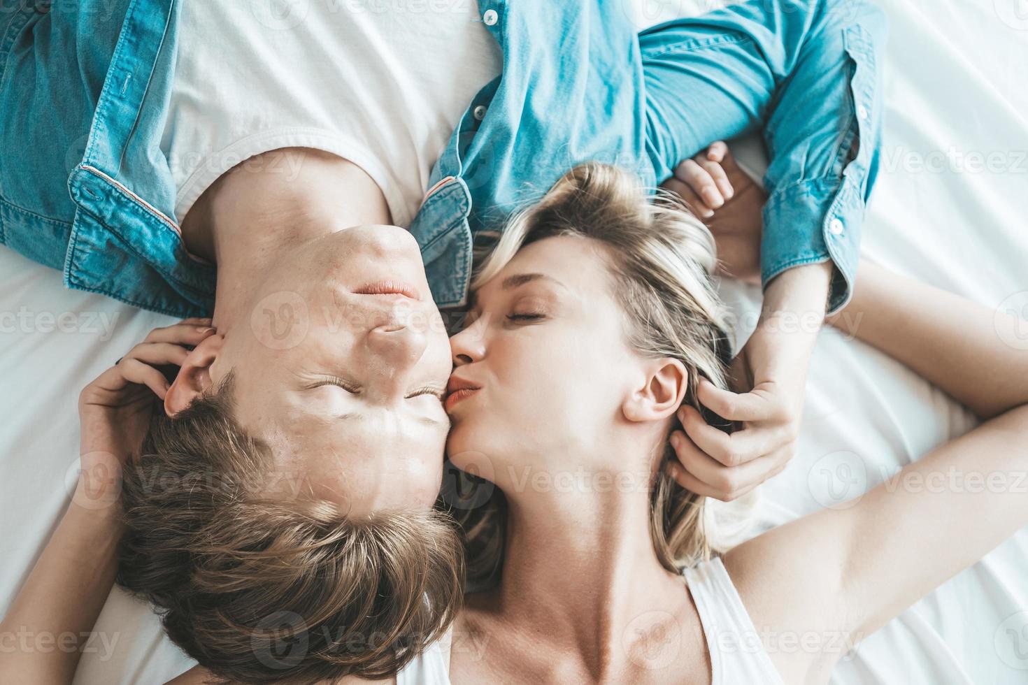 Happy couple together in the bedroom photo