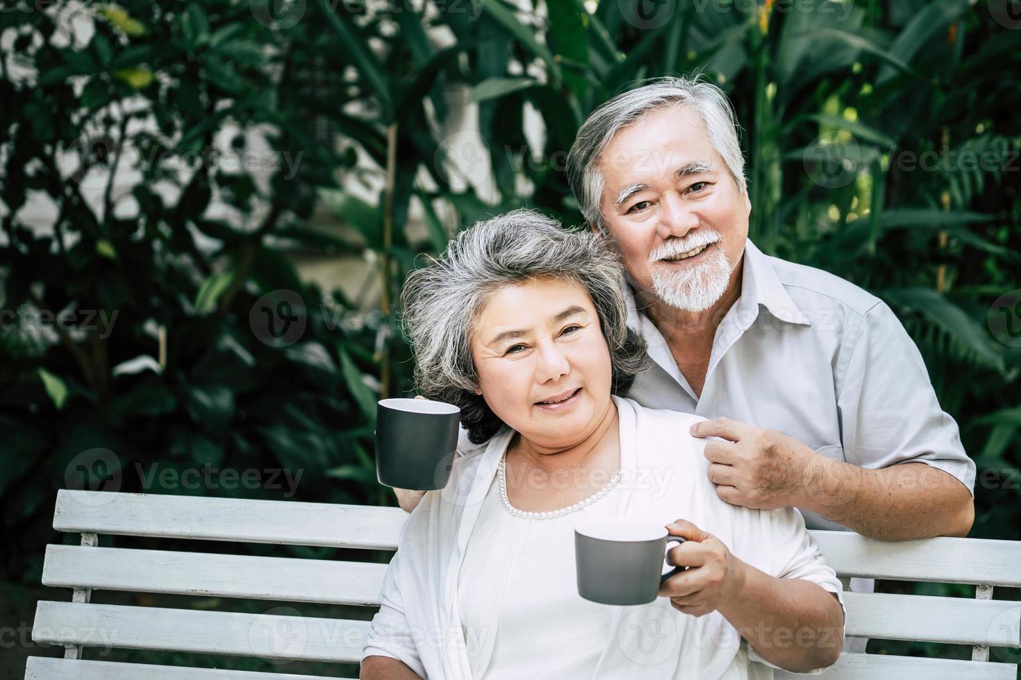 Senior couple playing together at park photo