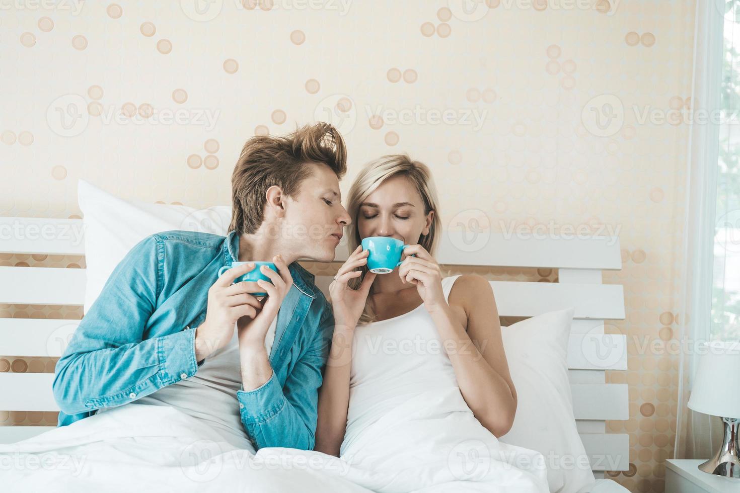 Happy couple drinking coffee in the morning photo