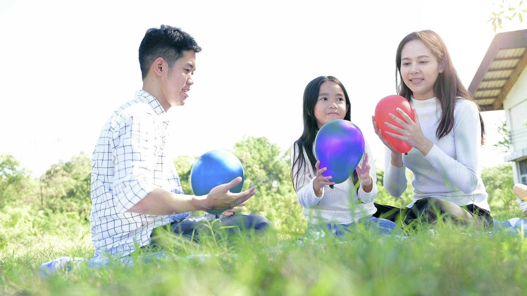 Asian family portrait with balloons photo