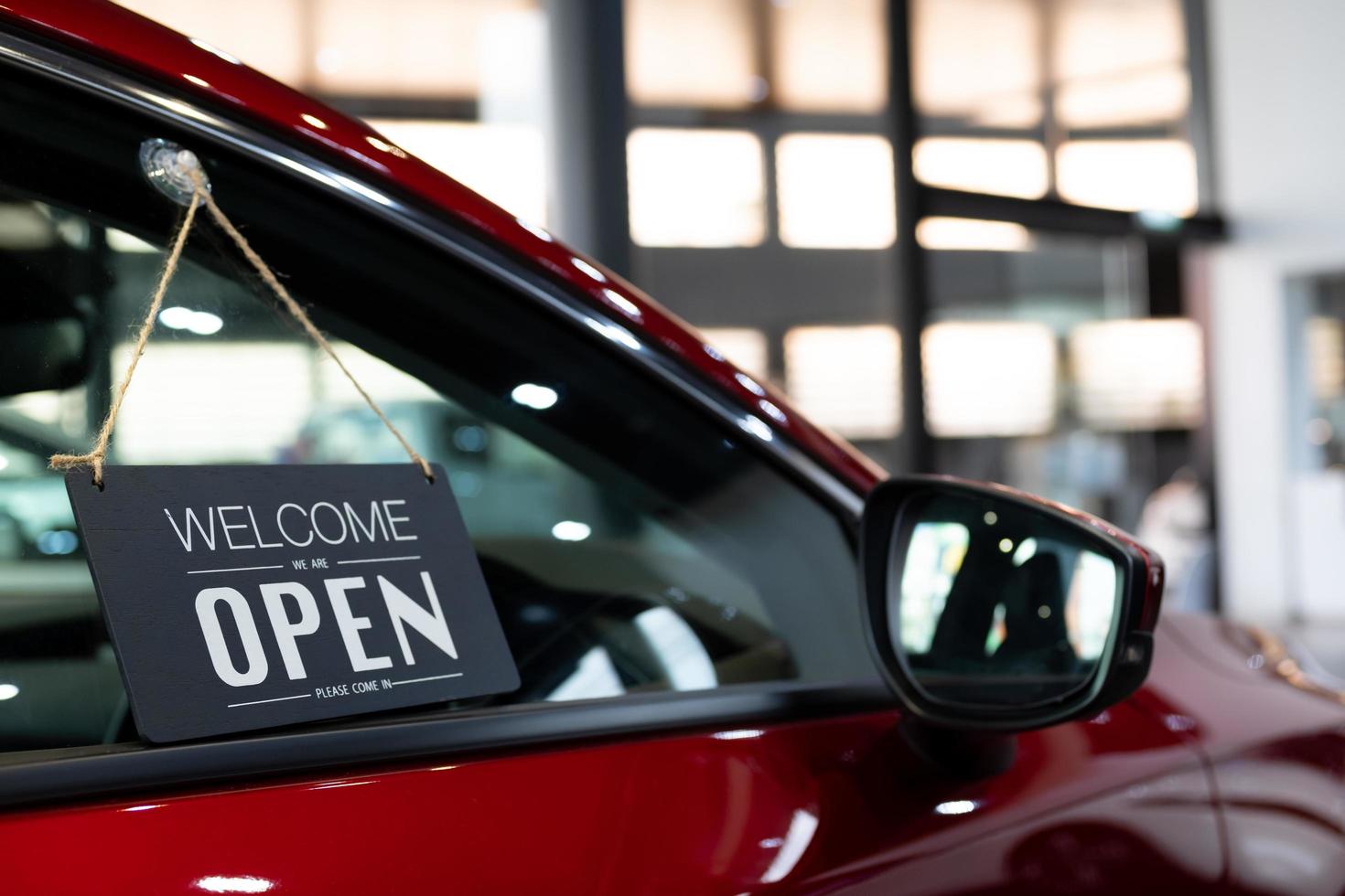 We are open sign on a car photo