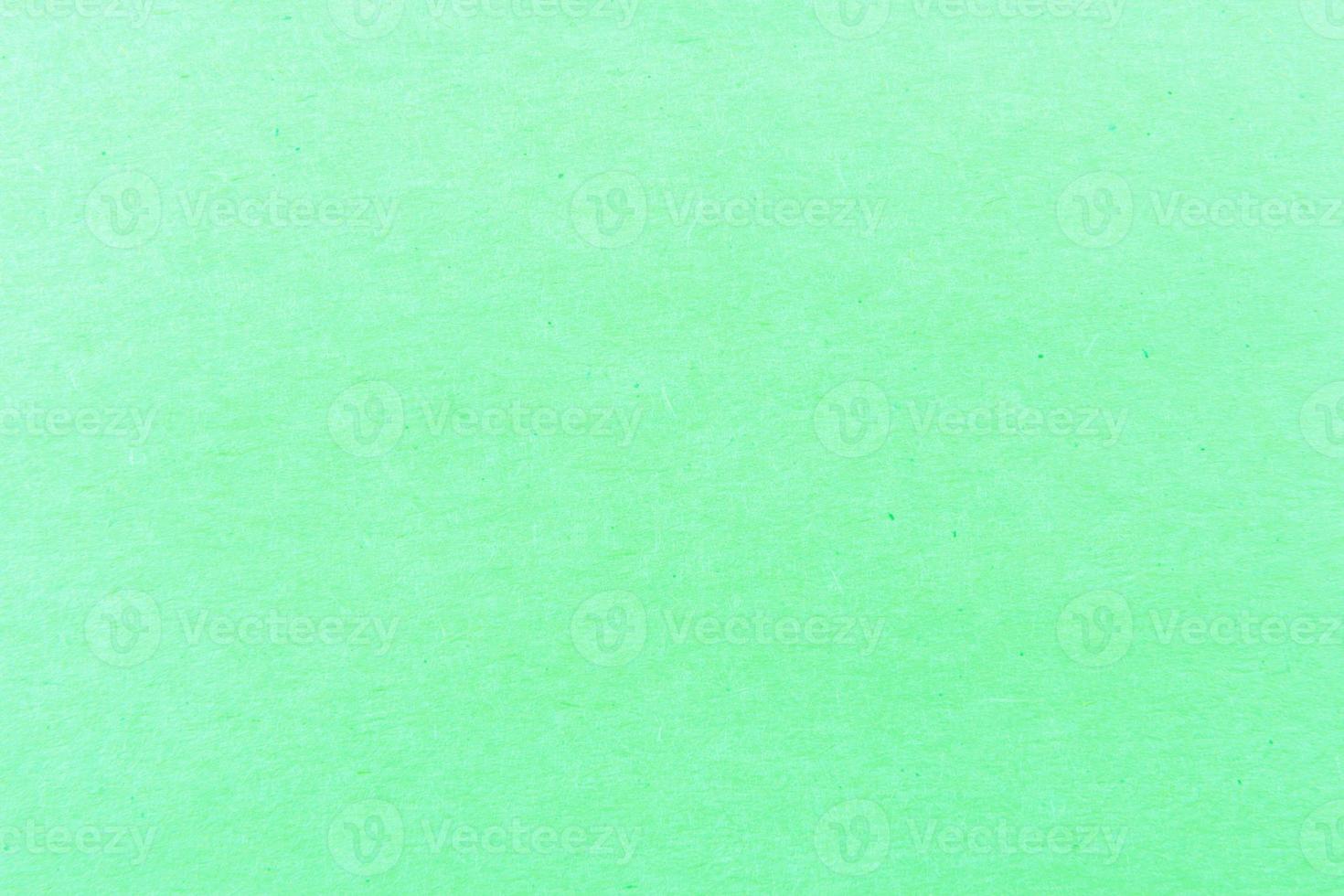 Close-up shot of light green paper texture pattern for background photo