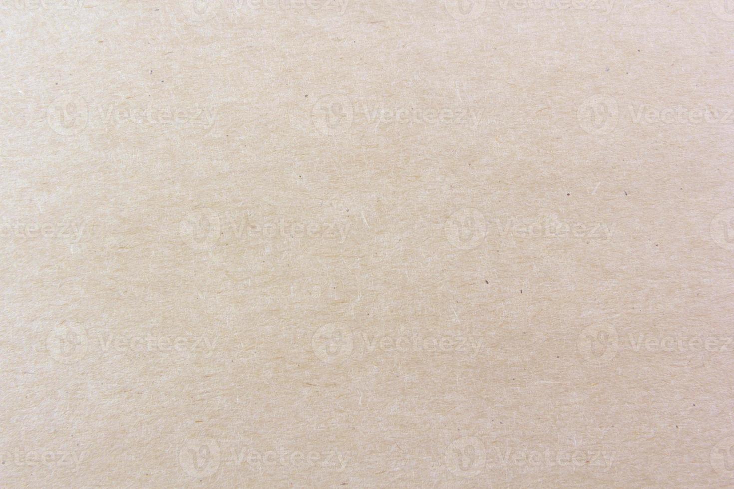 Close-up shot of light brown paper texture pattern for background photo