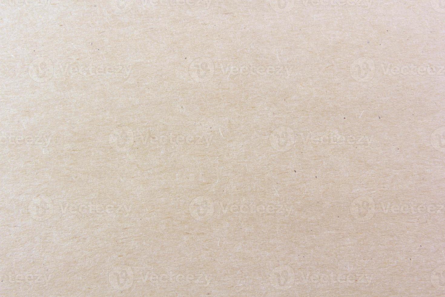 Close-up shot of light brown paper texture pattern for background photo