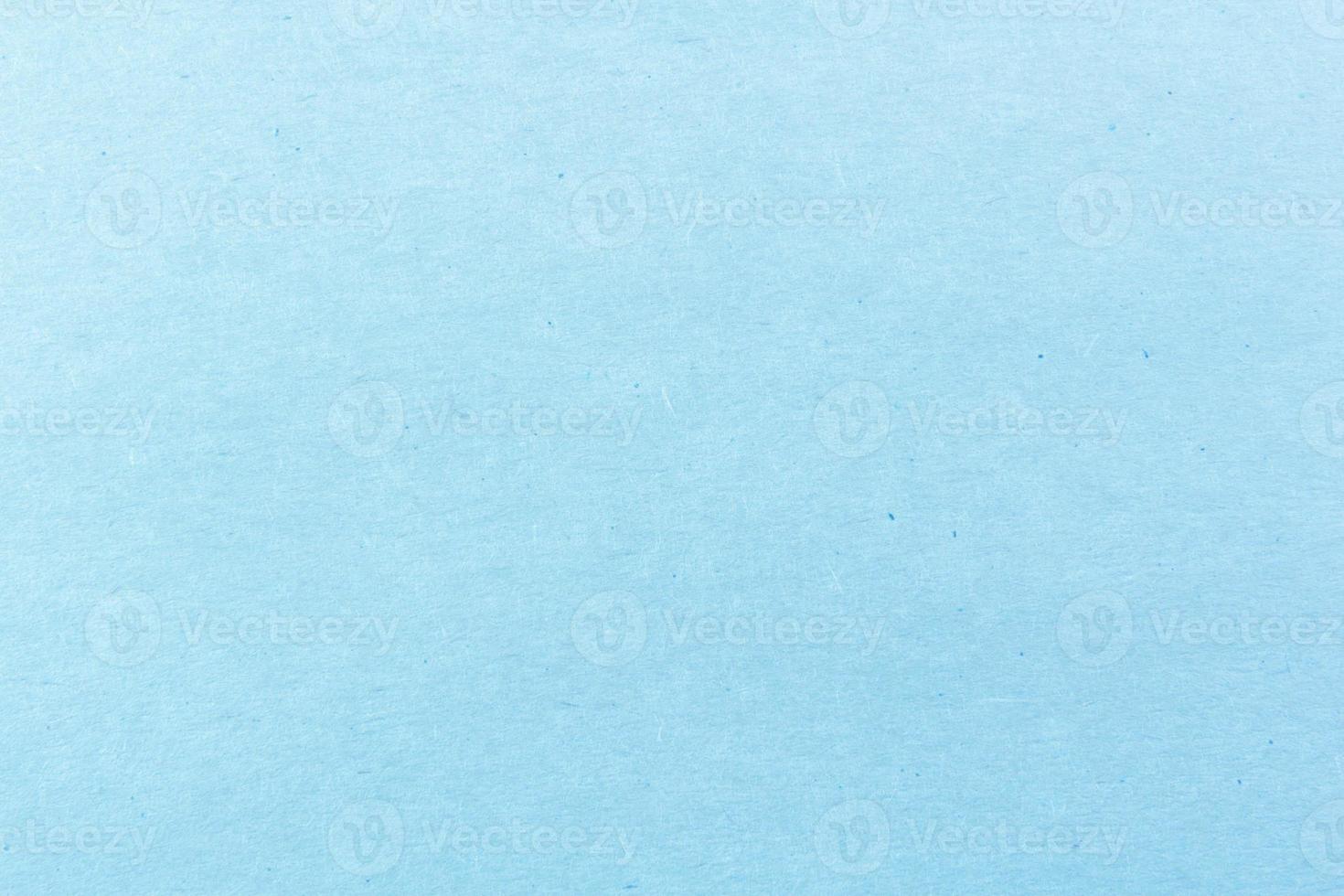 Close-up shot of light blue paper texture pattern for background photo