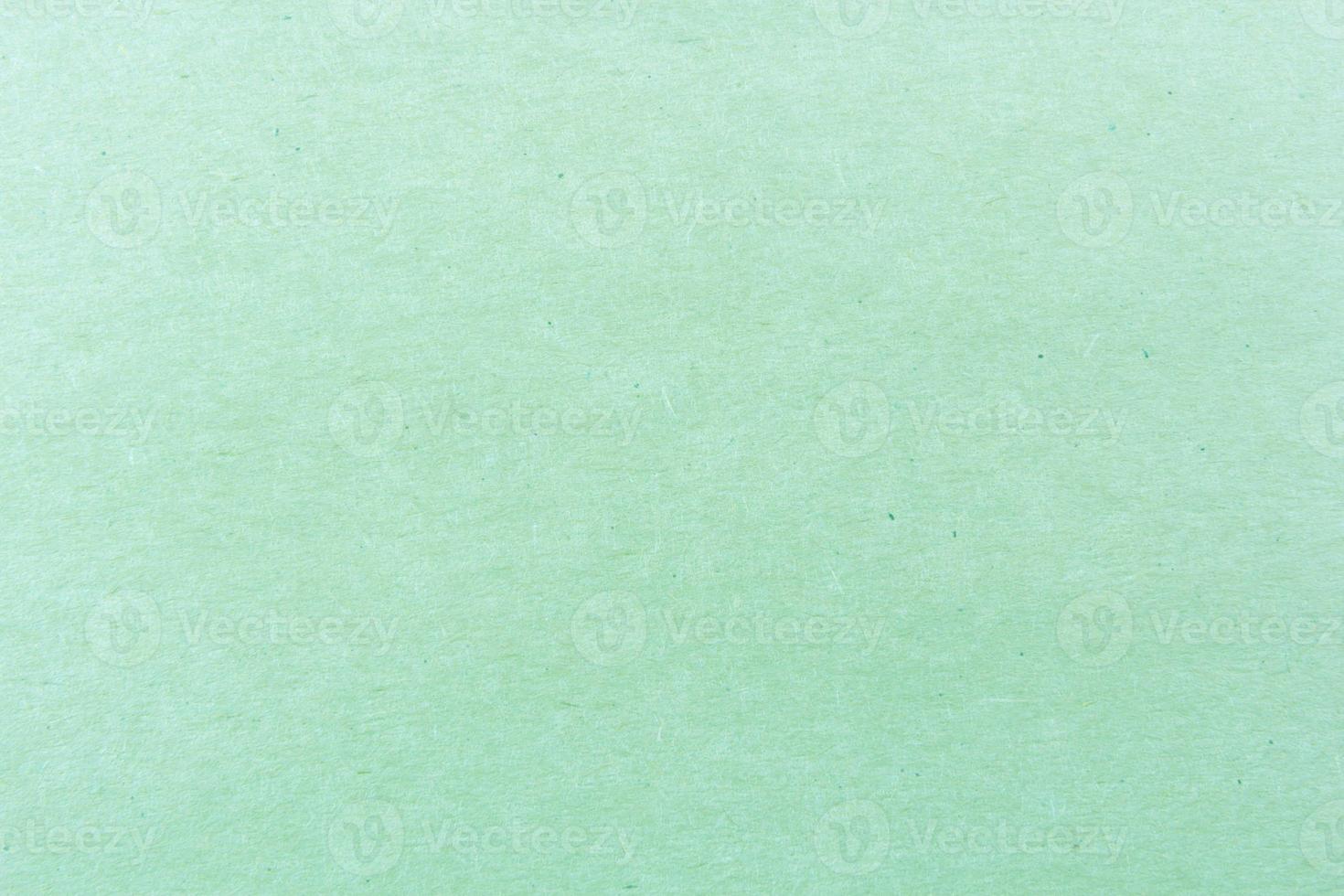 Primer plano del patrón de textura de papel verde claro para el fondo foto