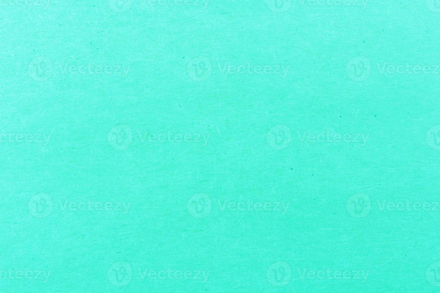 Close-up shot of green paper texture pattern for background photo