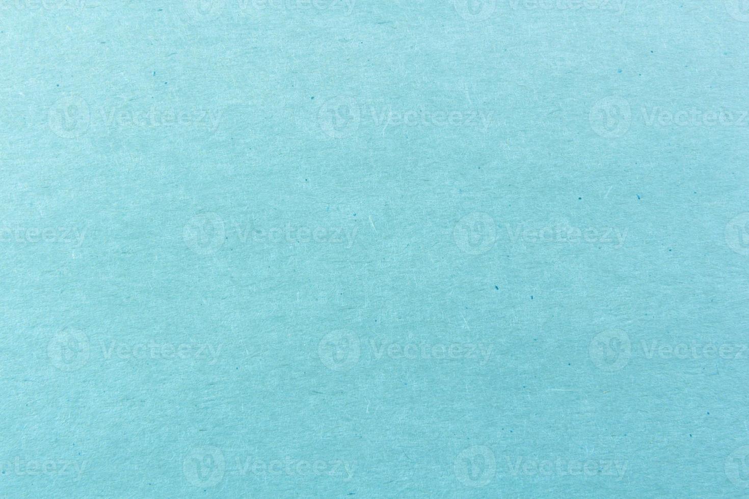 Close-up shot of light blue paper texture pattern for background photo
