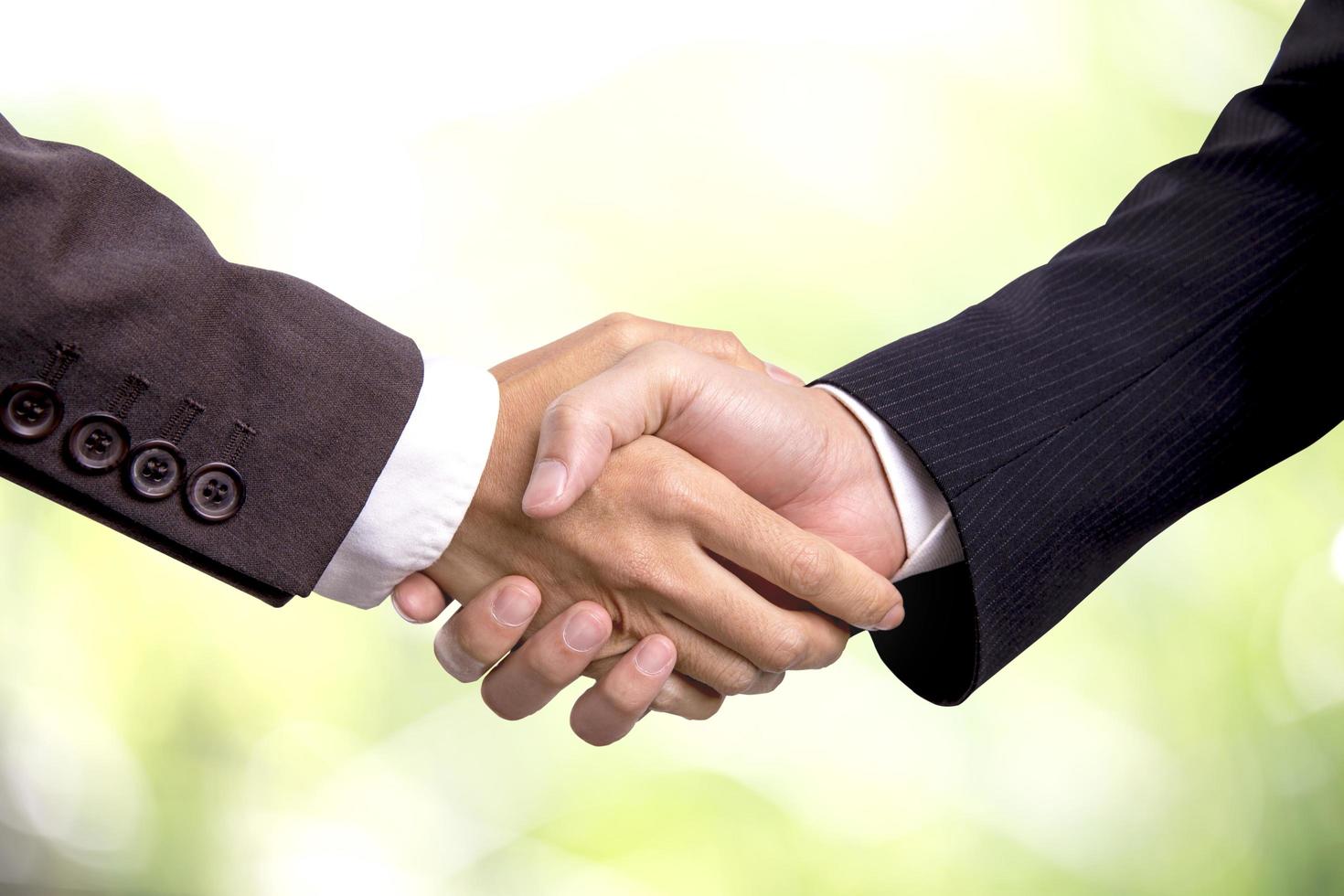 Two business men shaking hands photo