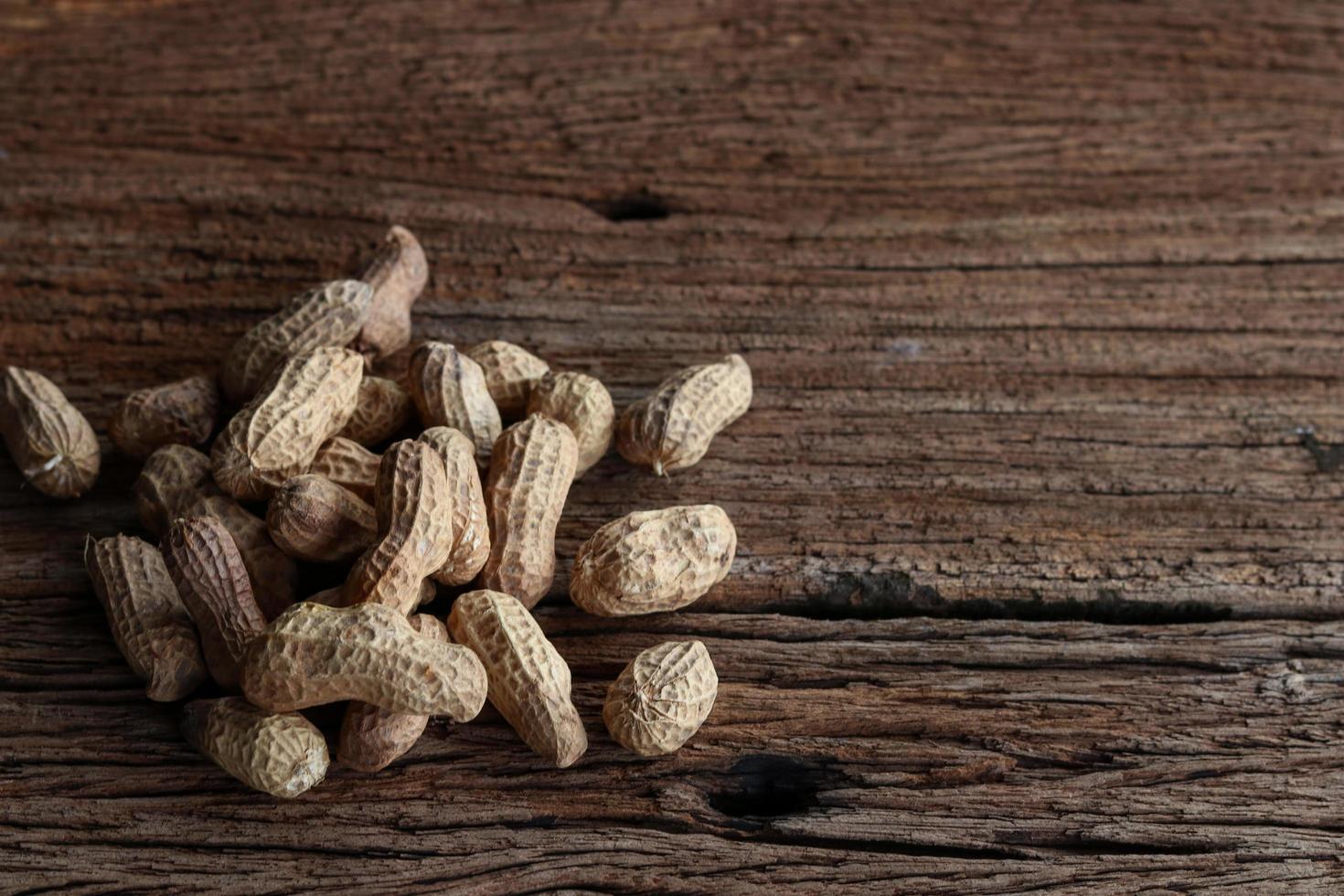 Peanuts on a wooden background photo