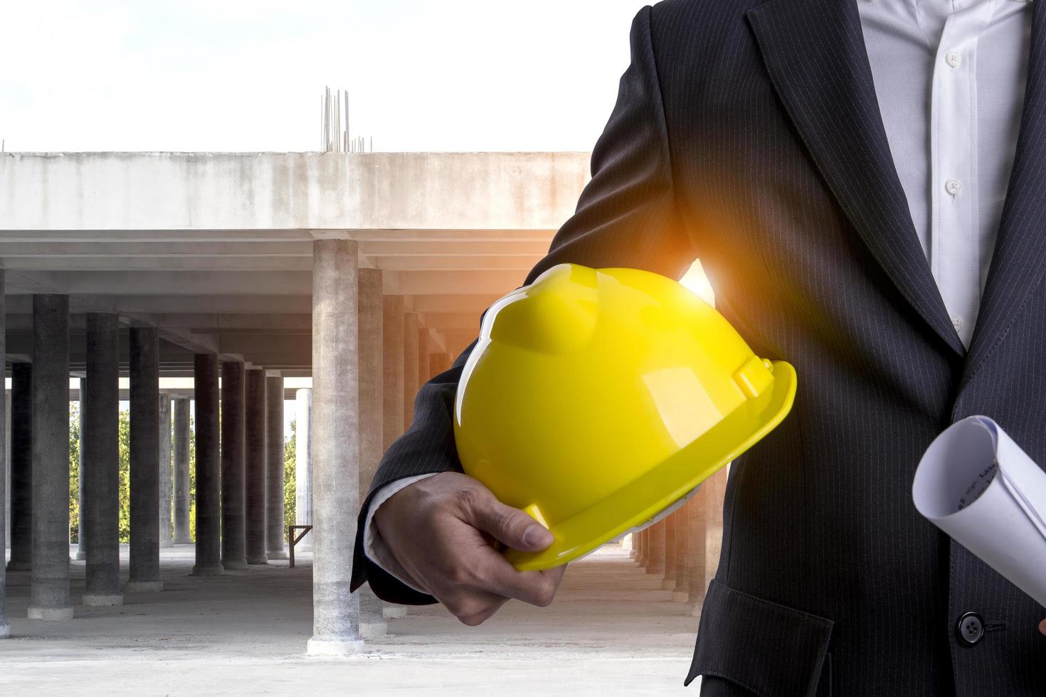 Business man with safety helmet photo