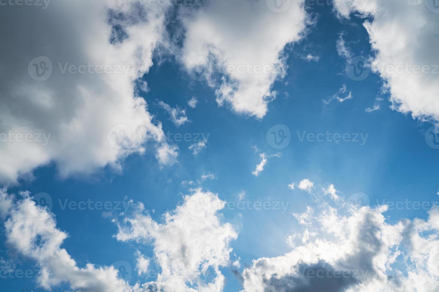 Cumulus clouds in a blue sky photo