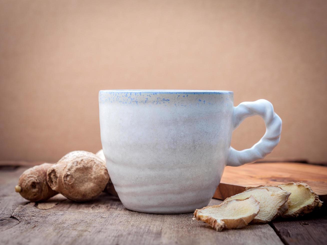 Ginger tea on a wooden background photo