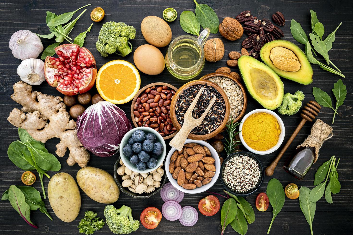 Top view of healthy foods on a dark stone background photo