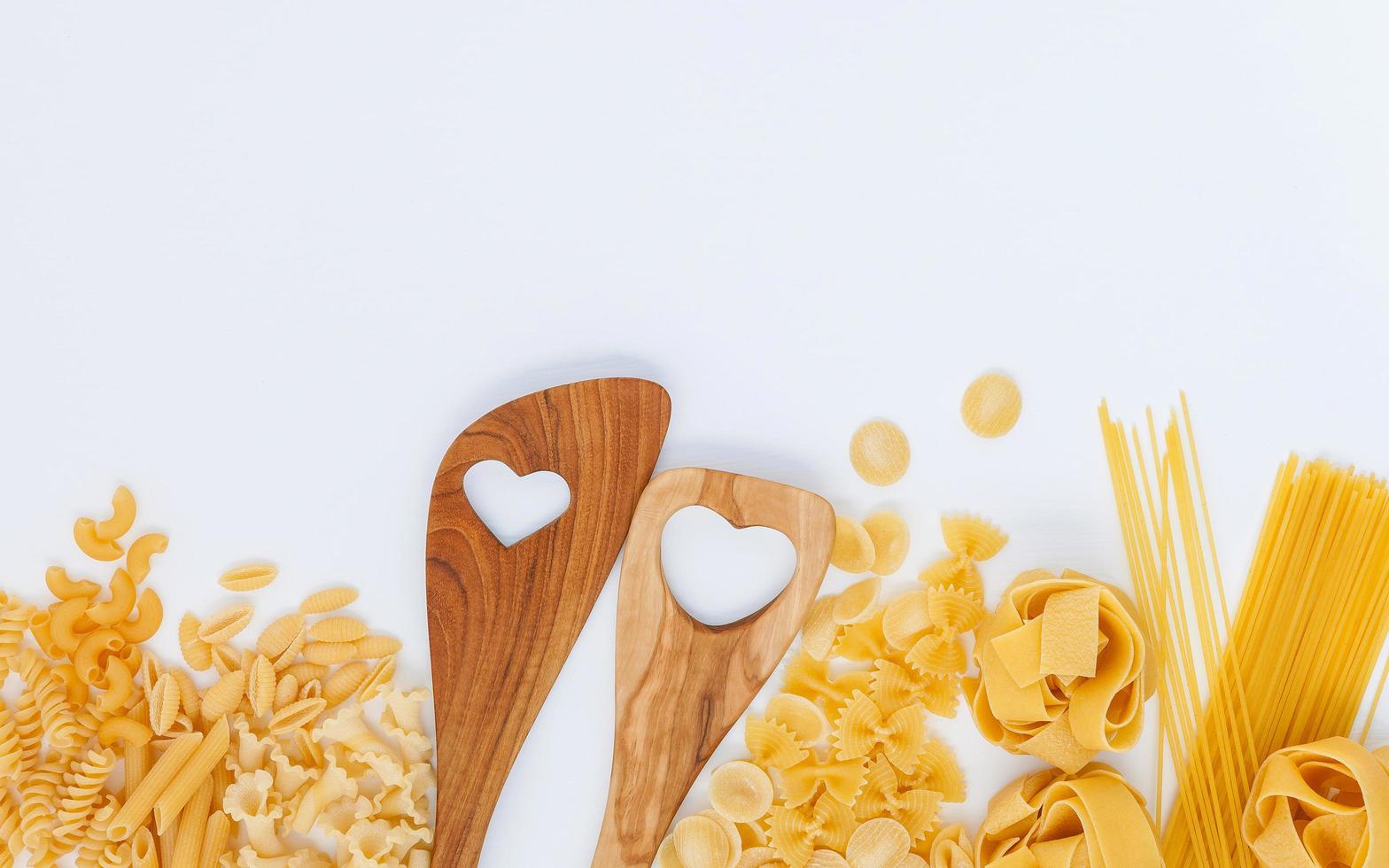 Wood utensils and pasta photo