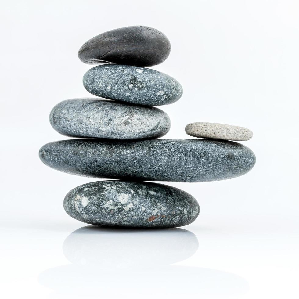 Stacked stones on white photo