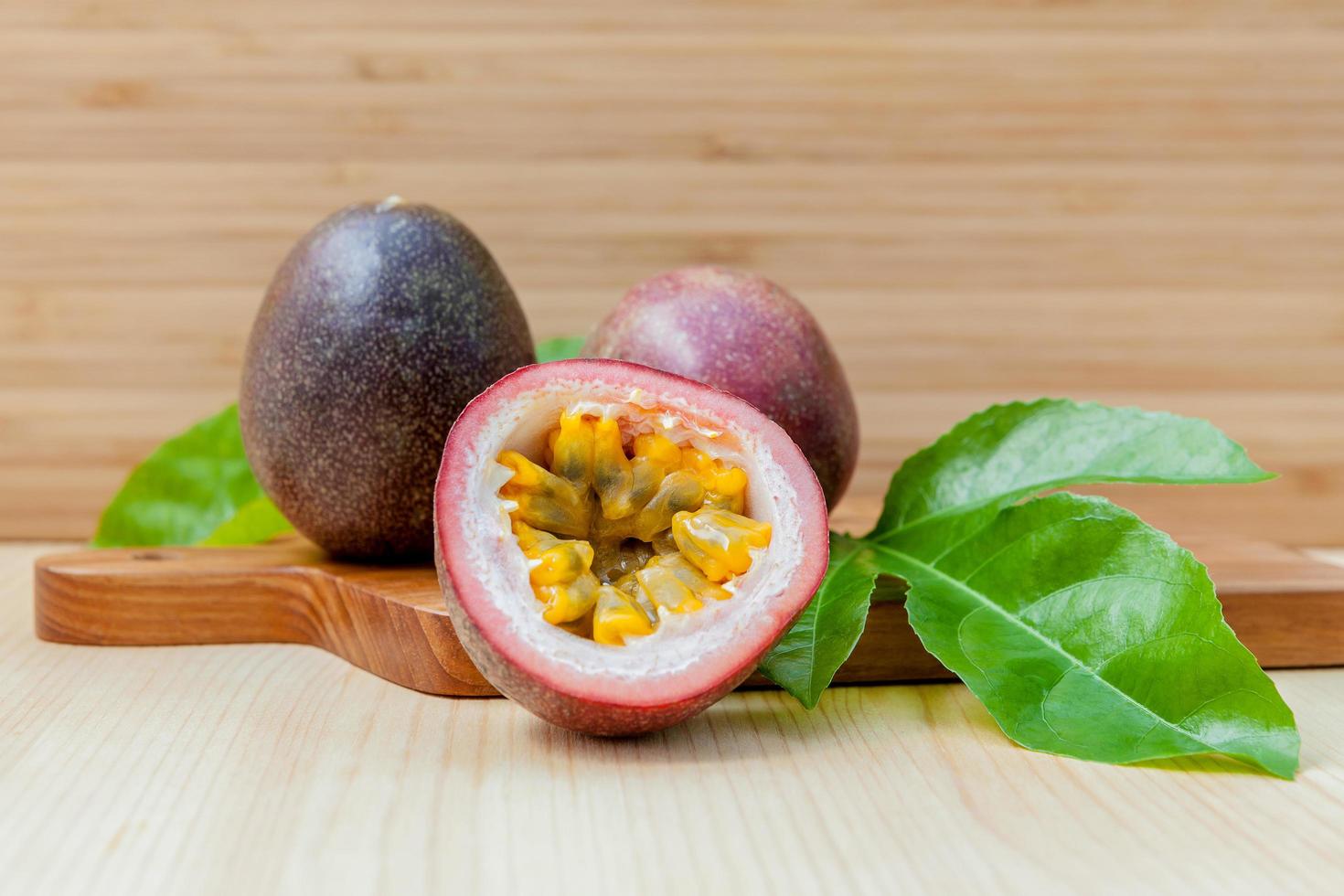 Fresh passion fruit on a wooden background photo