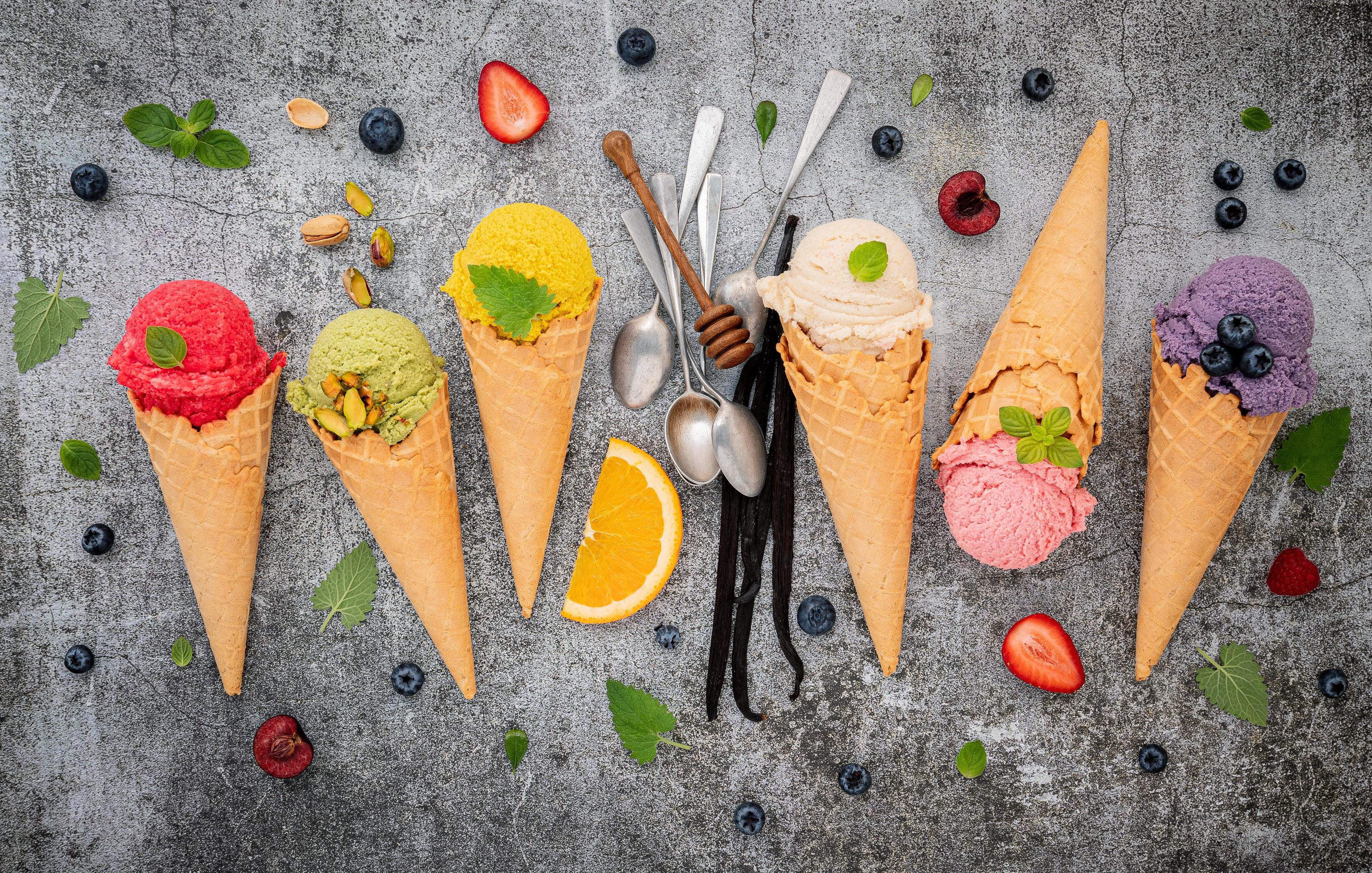 Colorful ice cream in cones on a concrete background 2055130 Stock Photo at Vecteezy