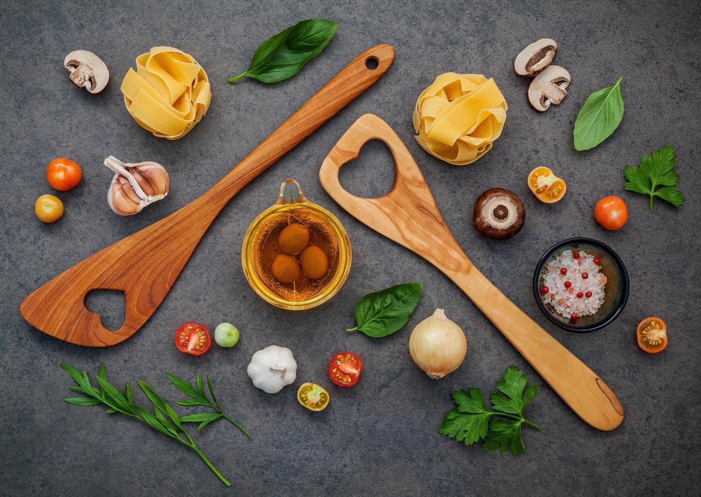 Top view of Italian ingredients on a dark gray background photo