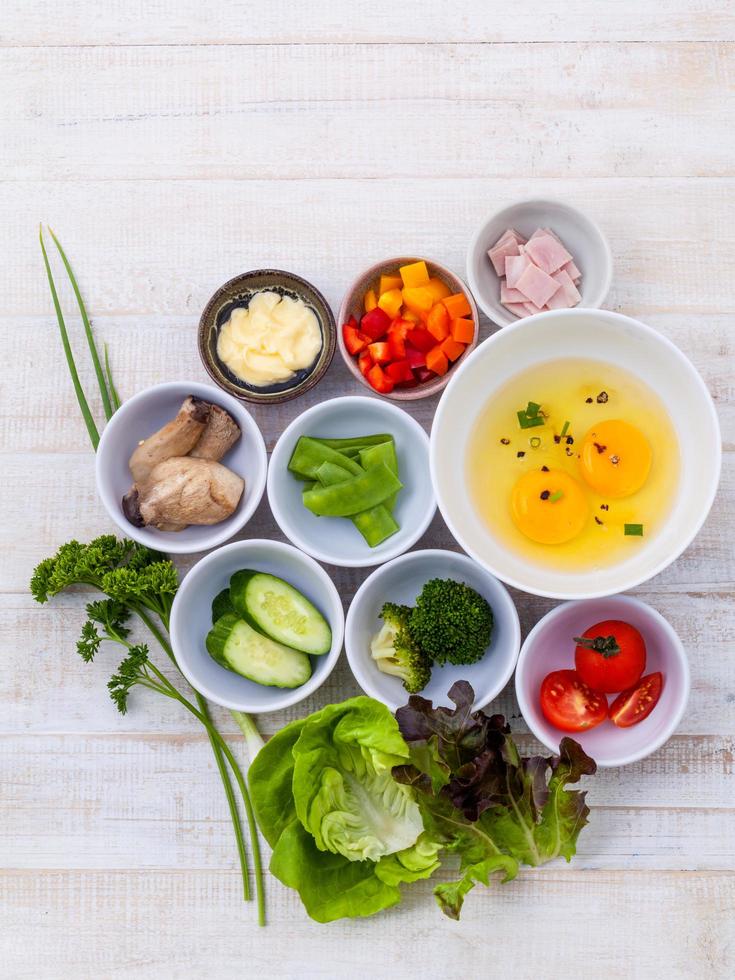 Ingredients for an omelet on wood photo