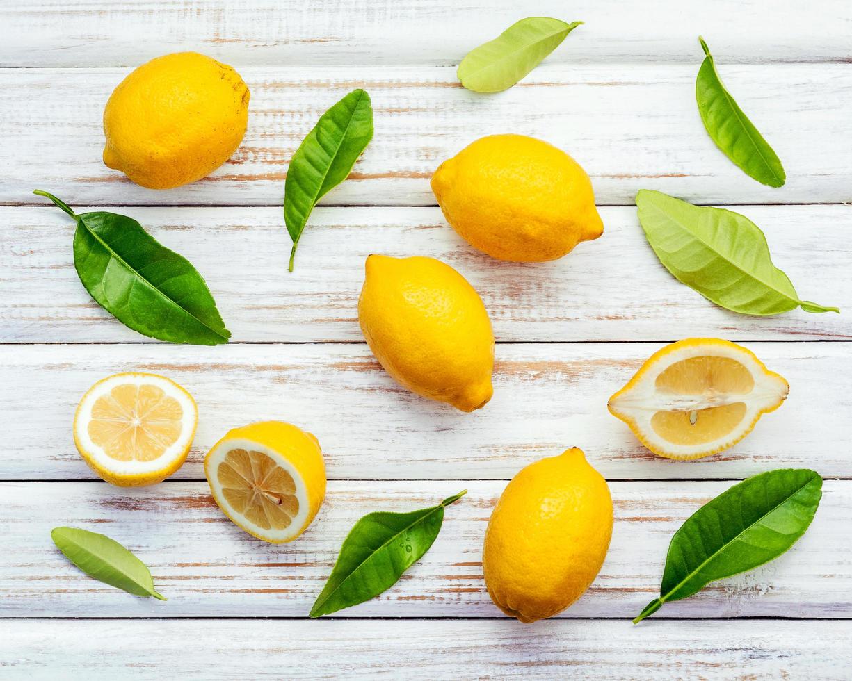 Fresh lemons on a shabby white background photo