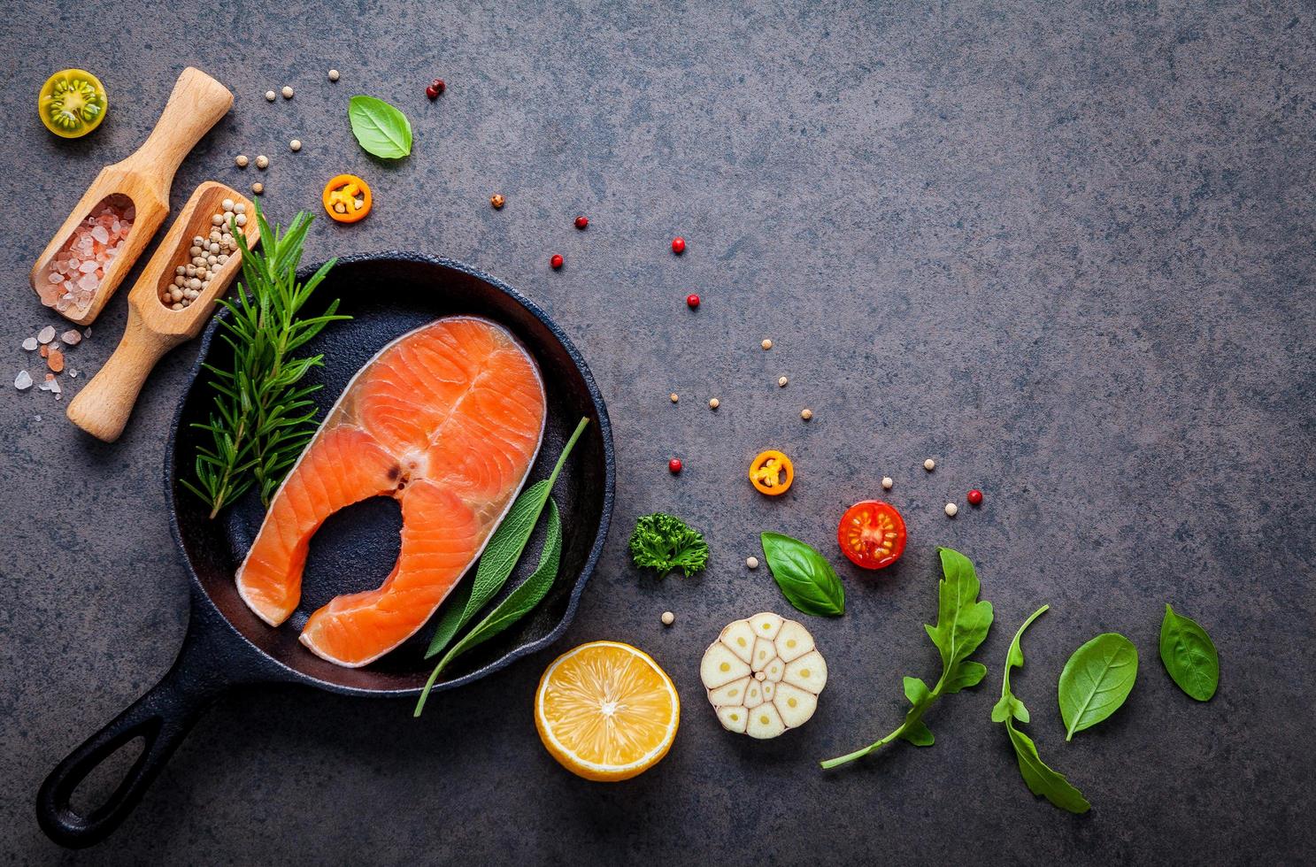 Various herbs and seasoning with salmon photo