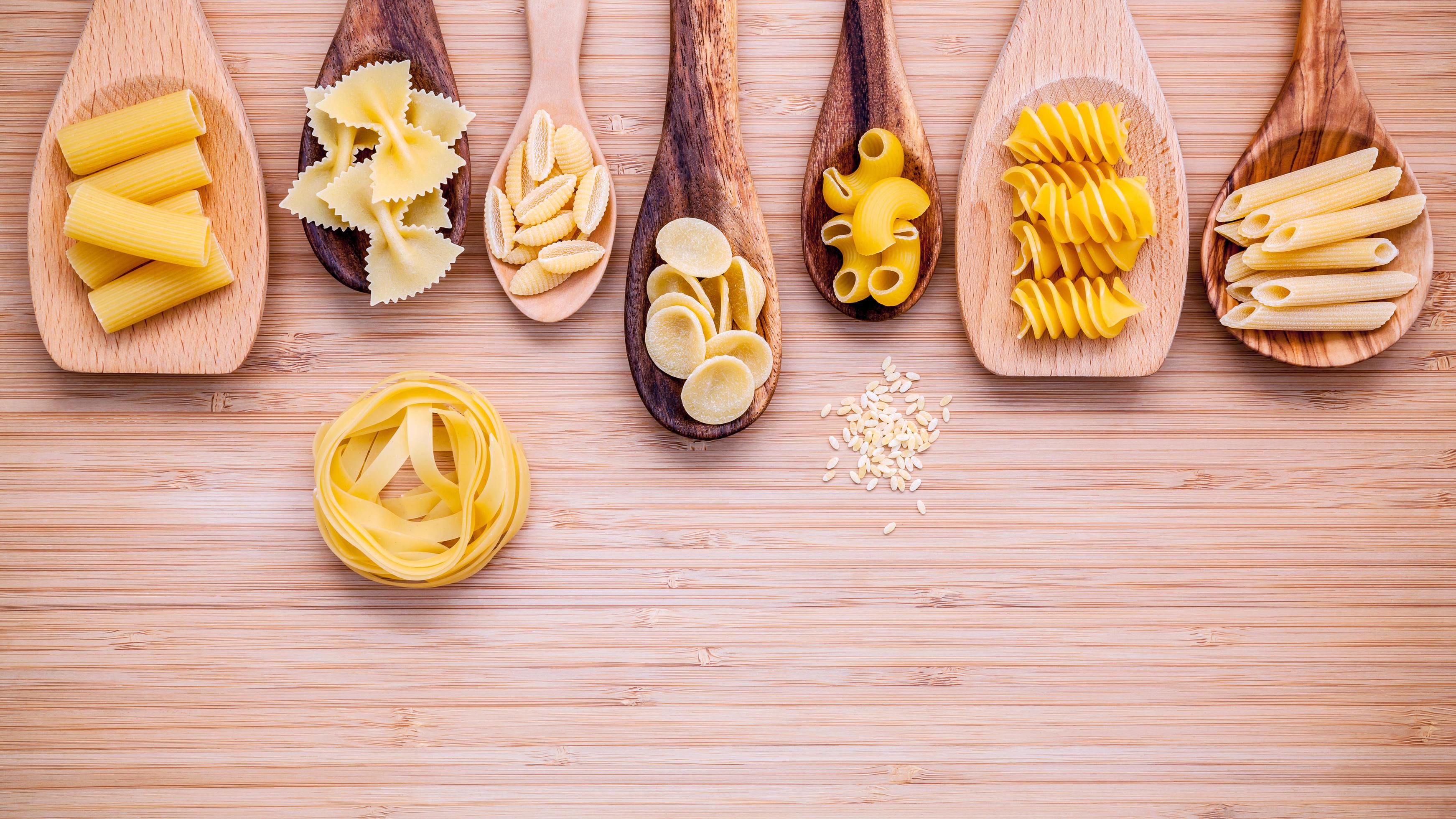 Assorted pastas in wooden spoons 2055388 Stock Photo at Vecteezy