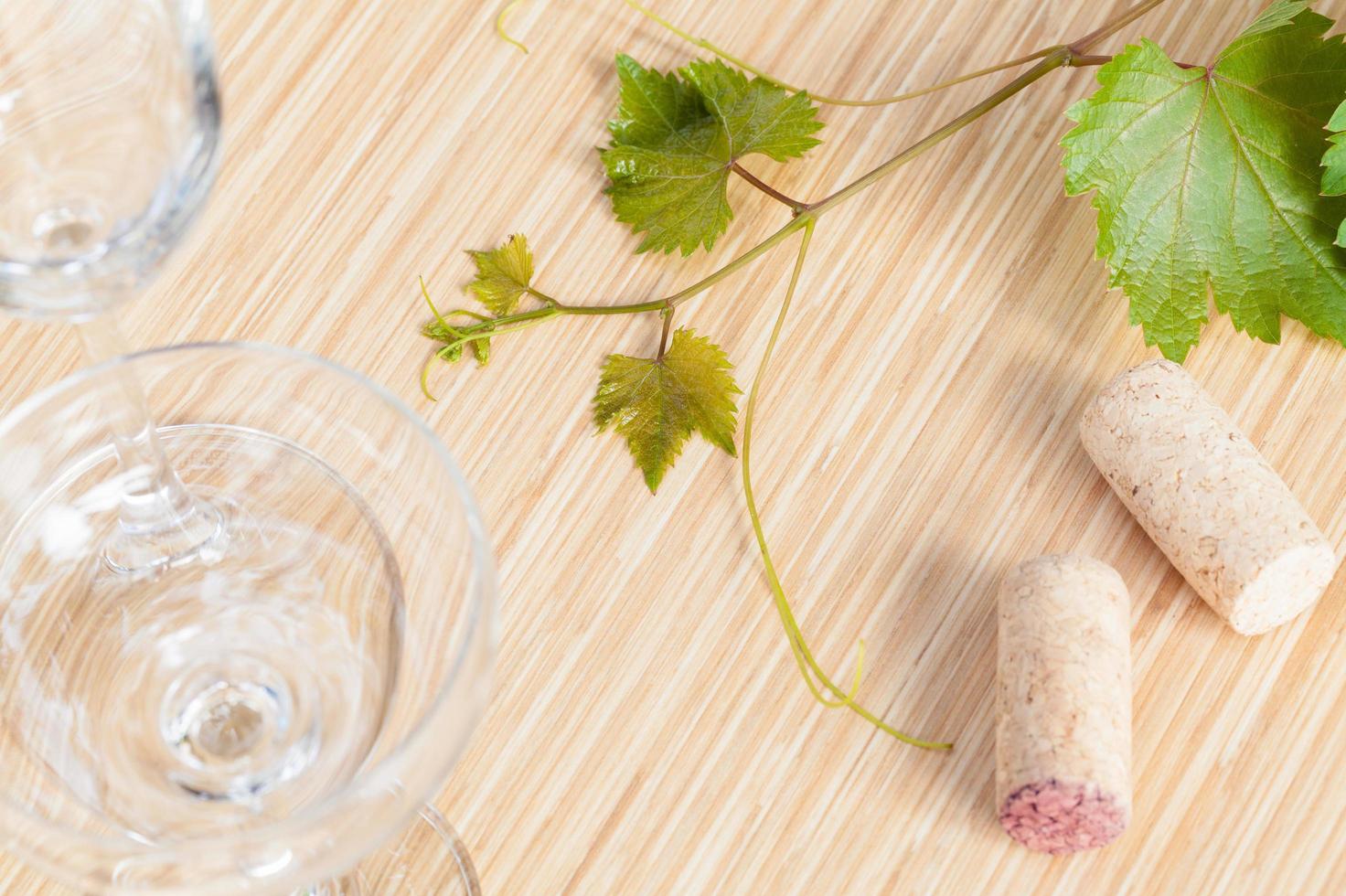 Ivy with wine corks and glasses photo