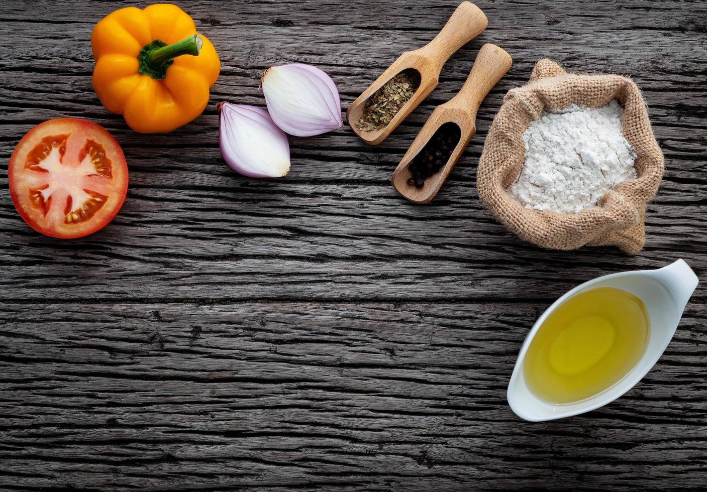 Fresh ingredients on dark rustic wood photo