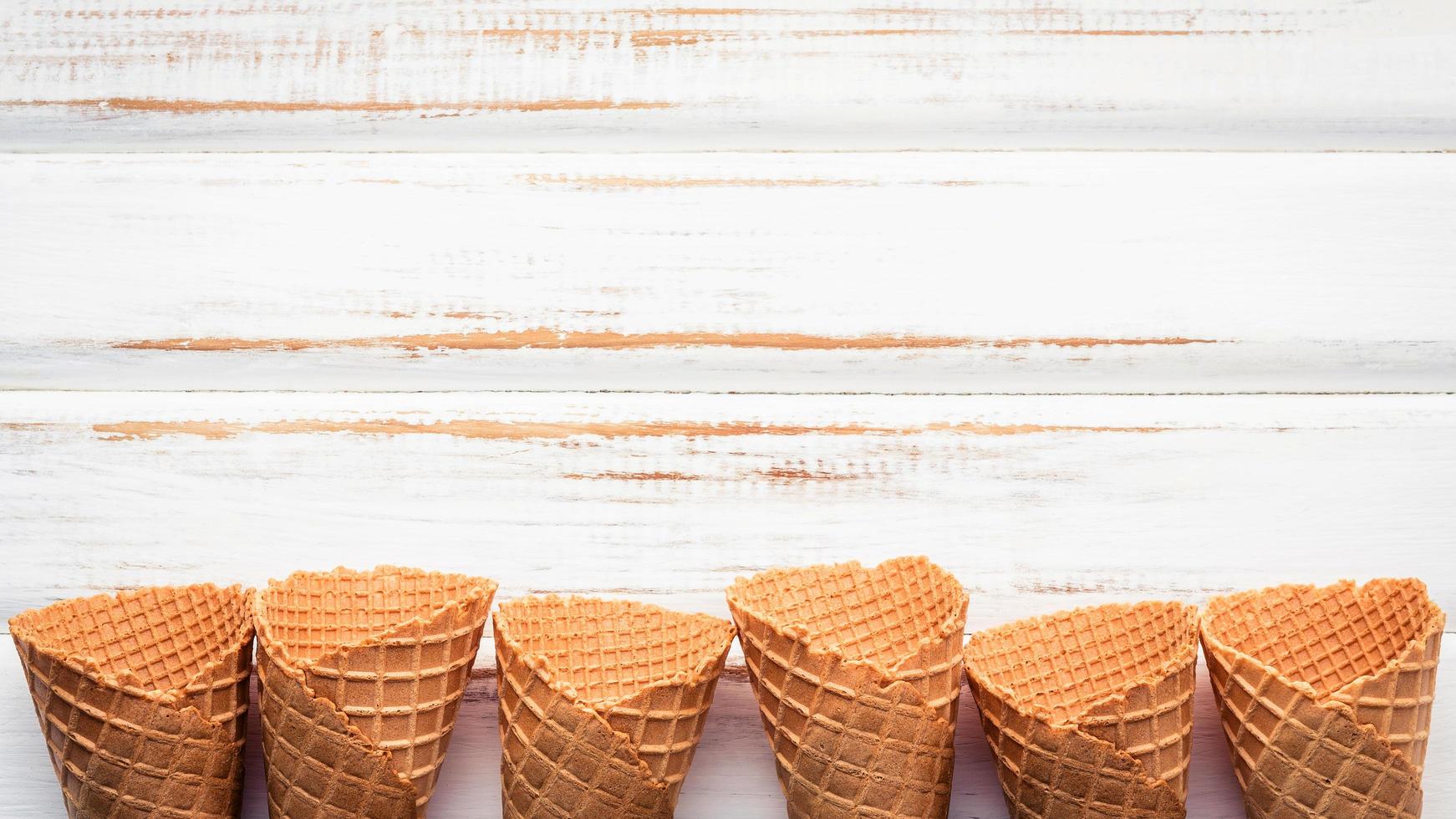 Ice cream cones with copy space on a shabby white background photo