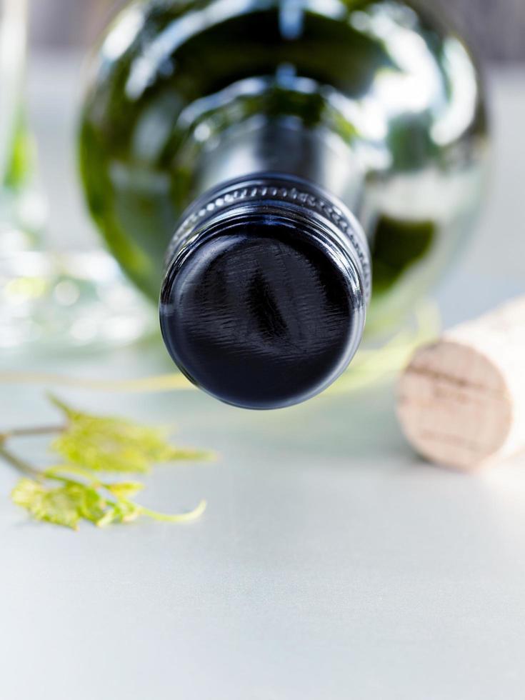 Wine bottle and cork with ivy photo