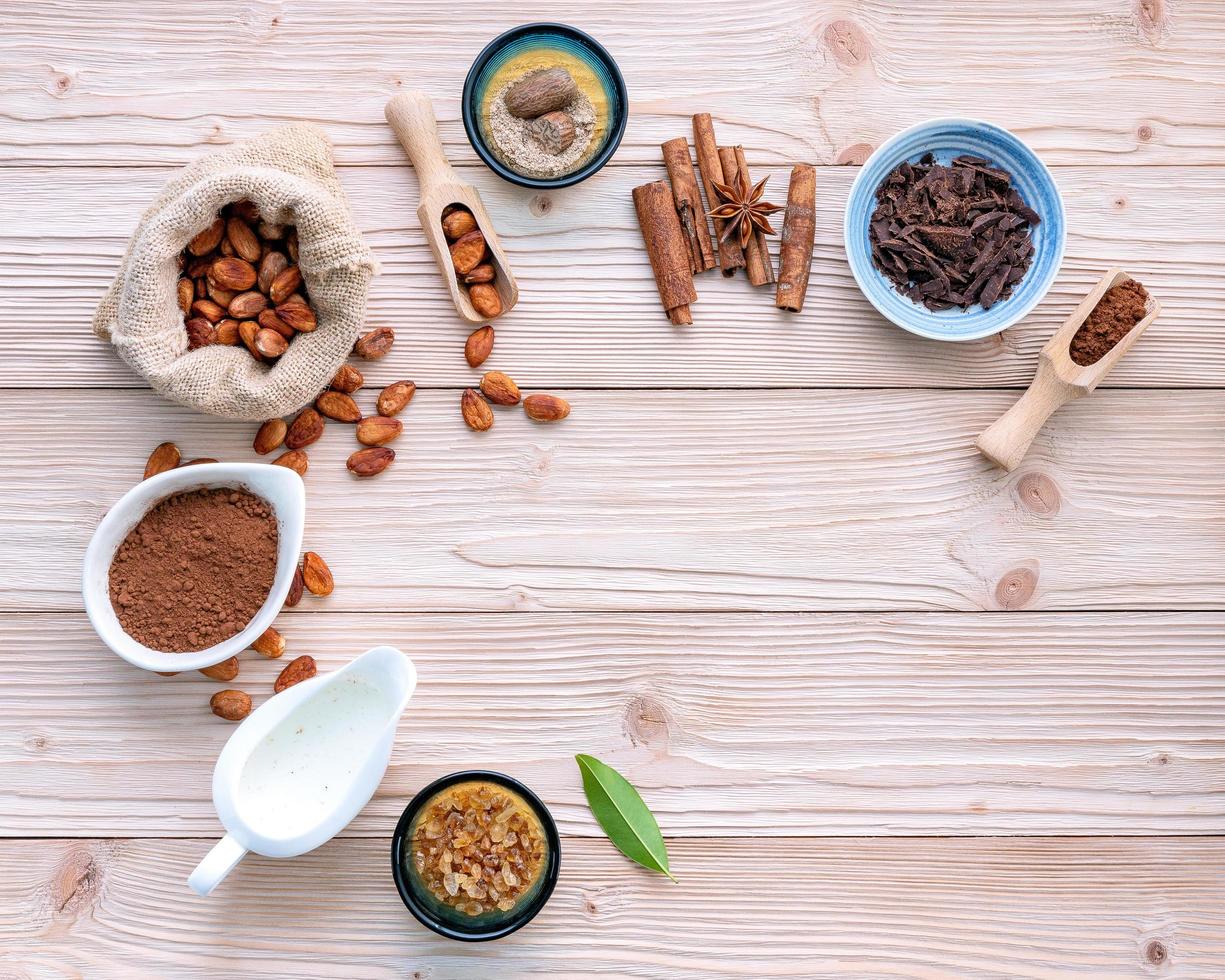 Cocoa powder and cacao beans on a rustic wooden background photo