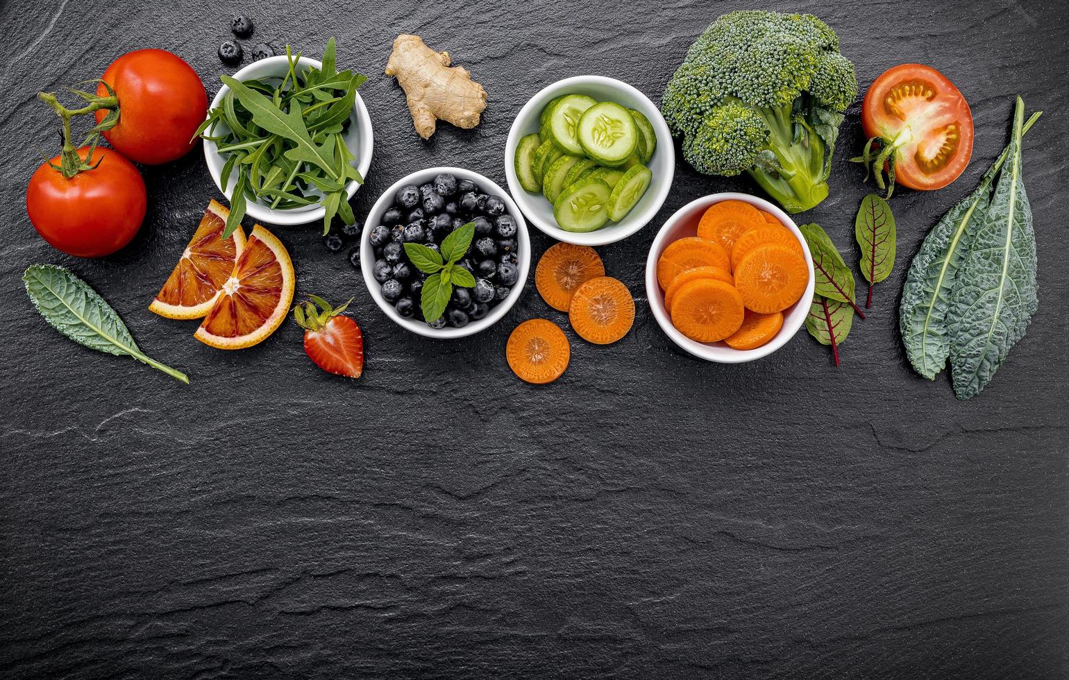 Bowls of fruit and vegetables photo