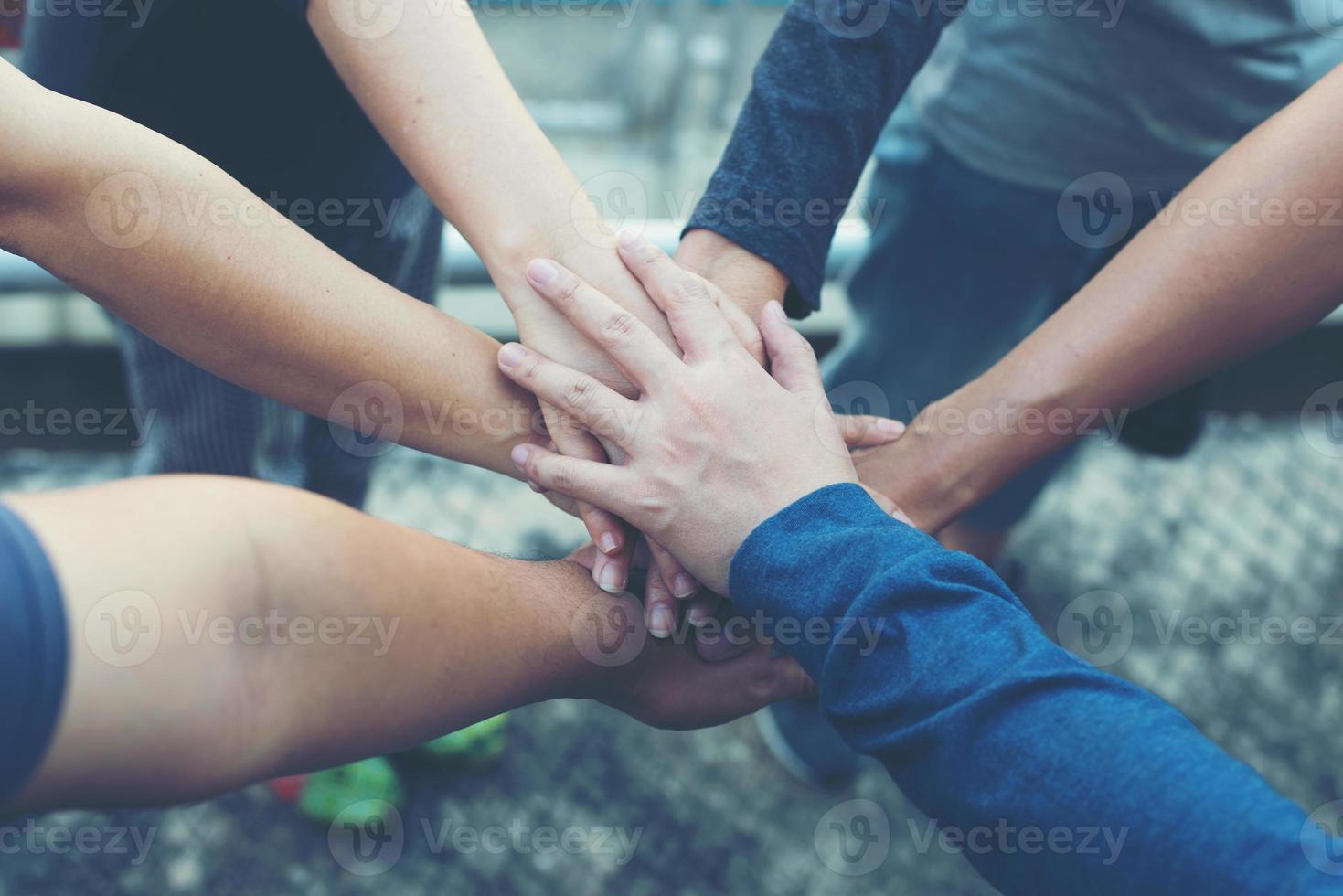 Hands together as a collaboration concept of teamwork photo