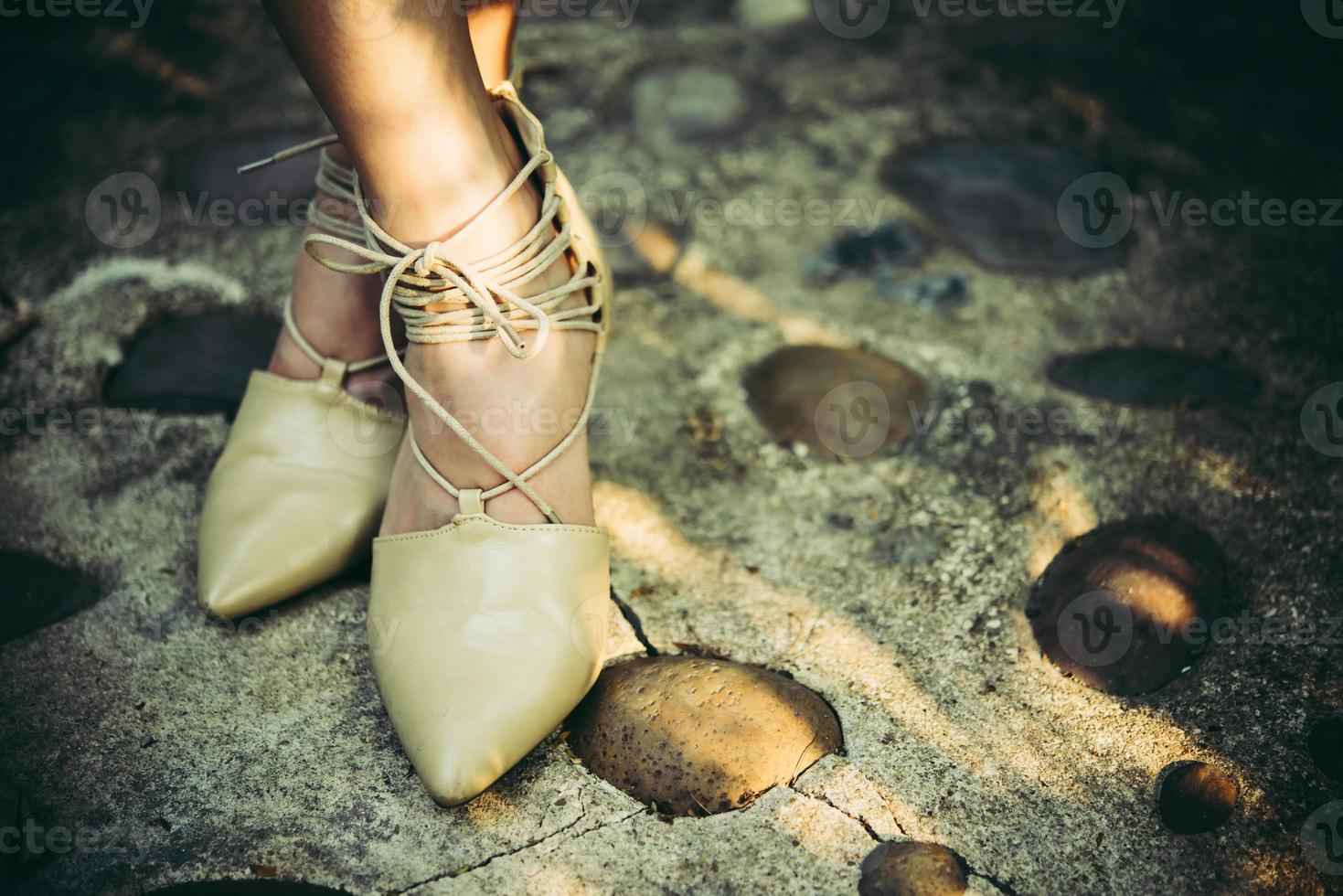 Woman's feet with high heels photo