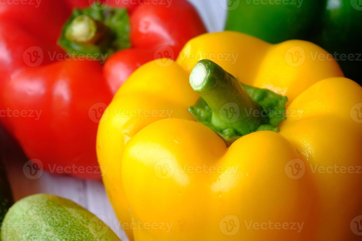 Yellow orange and red bell peppers photo