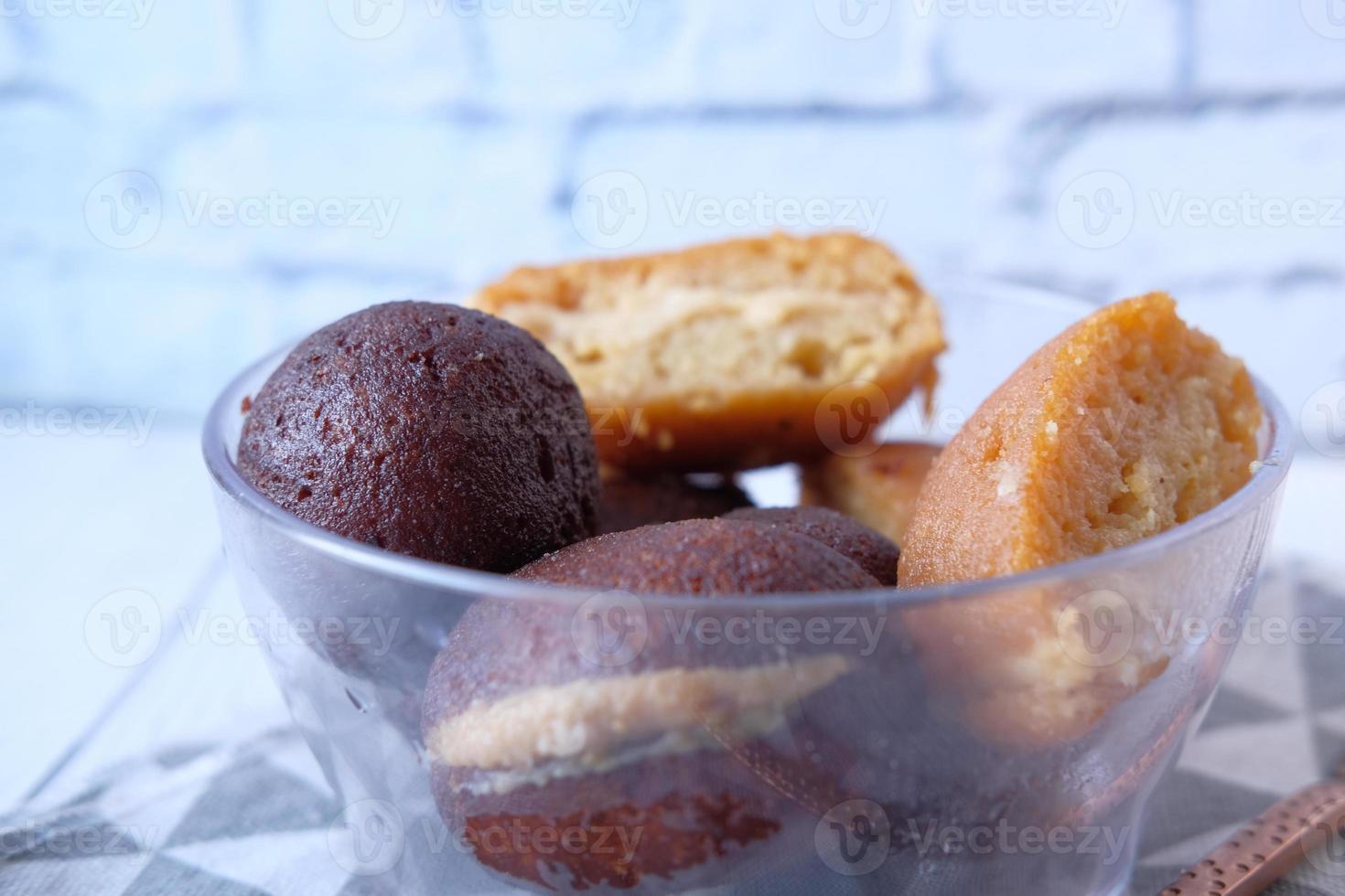 Indian sweets in a bowl on table photo